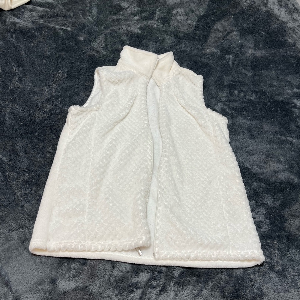White fuzzy vest size large